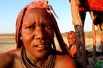 Portrait of Himba woman with traditional hair and jewellry, Kaokoland, Namibia October 2015