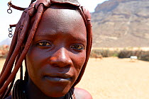 Portrait of Himba woman with the traditional hair style, Kaokoland, Namibia October 2015