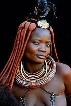 Portrait of Himba woman with traditional hair style and jewellry, Kaokoland, Namibia October 2015