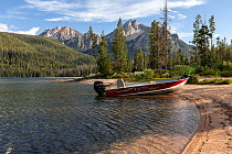 Boat beached on shore of Stanley Lake, Sawtooth National Recreation Area, Idaho, USA. July 2015.
