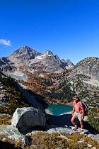 Vicky Spring hiking near Horsefly Pass above Lewis Lake, North Cascade National Park Complex, Washington, USA, October 2015. Model Released.
