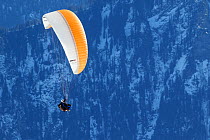Paraglider in mountain landscape, Bernese Alps, Switzerland, November 2014.