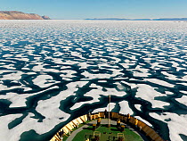 Broken one year ice off the coast of Ellesmere Island, seen from prow of boat, Nunavut, Canada, August 2007.
