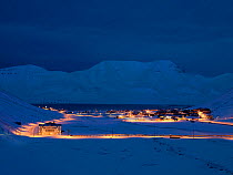 Longyearbyen town at first light, with street lamps lighting the roads,Svalbard, Norway, February.