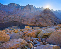 The first rays of sunshine above the Sierra Crest, illuminating granite, Mitre Basin, Sierra Nevada, Sequoia National Park, California, USA, August