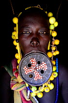 Mursi woman with large clay lip plate. Mago National Park. Omo Valley, Ethiopia.