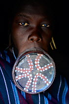 Mursi woman with large clay lip plate. Mago National Park. Omo Valley, Ethiopia.