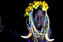 Young girl wearing traditional headdress. Mursi tribe, Mago National Park. Omo Valley, Ethiopia.
