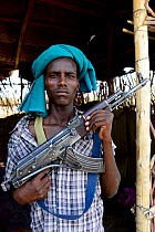 Afar man with rifle, Danakil Depression, Afar Region, Ethiopia, Africa. November 2014.