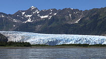 View of Bainbridge Glacier, with glacial water in the foreground, Prince William Sound, Alaska, USA.