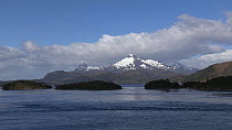 Tracking shot of White Narrows, with snow covered mountains in the background, Patagonia, Chile.