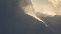 Close up of snow blowing, seen from a boat passing through Lemaire Channel, Antarctic Peninsula.