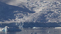 Small iceberg at the foot of a glacier, Lemaire Channel, Antarctic Peninsula.