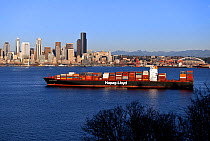 Freighter ship anchored, Elliot Bay, with the city of Seattle in the background. Washington, USA, February 2015.