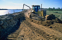Reinforcement of dykes along the Rhone River after severe flooding in 2003. Camargue, France 2003.