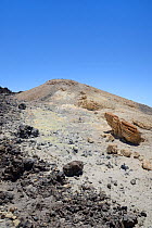 Fumarole field near the summit of Mount Teide volcano, with lava rock and pumic deposits stained yellow by sulphurous gas emissions, Tenerife, May.