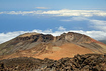 Old lava flows and summit of Pico Viejo Volcano viewed from Mount Teide, with masses of pumice deposits around the crater, Tenerife, May 2014.