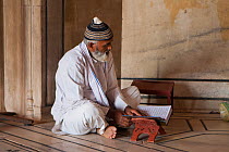 Man praying at Jama Masjid Mosque, Old Delhi, India, November 2013.