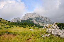 Adiabatic clouds forming above the 2386m peak of Mount Maglic, Bosnia's highest mountain, as warm air rises, cools and is blown by the wind, Sutjeska National Park, Bosnia and Herzegovina, July 2014.