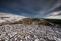 Carboniferous Limestone pavement above Malham Cove, with light dusting of snow, Yorkshire, UK.  January 2014