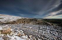 Carboniferous Limestone pavement above Malham Cove, with light dusting of snow,Yorkshire, UK.  January 2014