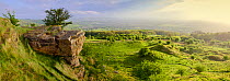Panoramic view of limestone outcrop and countryside at Cleeve Hill on the Cotswold Edge, Gloucestershire, UK. Panoramic image. May 2015.