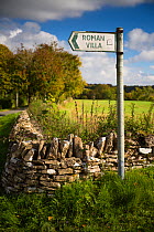 Sign for Chedworth Roman Villa at Yanworth, Gloucestershire, UK. October.