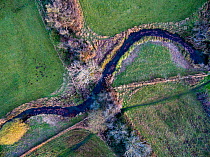 River Eye flowing through water meadows. Greystones Farm Nature Reserve, Site of Special Scientific Interest (SSSI), Gloucestershire Wildlife Trust.  Aerial drone with CAA permit. November 2015.