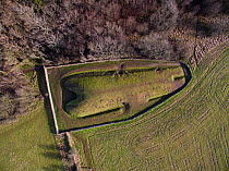 Aerial view of Belas Knap, a neolithic chambered long barrow on the Cotswold Way, Winchcombe, Gloucestershire, UK.  Shot by aerial drone with CAA permit. January 2016.