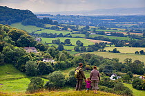 Family walking on Selsley Common on the Cotswold Way, Gloucestershire, UK.August 2012. Model Released.