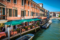Riverside restaurants on Rio De San Lorenzo, Venice, Italy, April.
