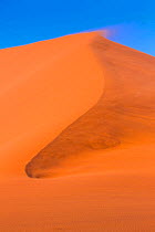 Top of sand dune with wind blowing sand, Namib Naukluft National Park, Namibia