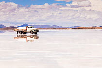 Harvesting salt on Salar de Uyuni salt flats, Atacama Desert, Bolivia. December 2013.