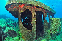 A diver on the wreck of the Vera K, a Lebanese freighter, sunk in 1974 on the reef near Paphos, Cyprus, Mediterranean Sea