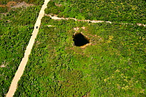 Aerial view of a  cenote, a  freshwater hole; they occur all over the Yucatan peninsula, Mexico