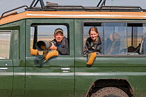 Wildlife Photographer Ingo Arndt and his wife, videographer Silke Arndt, working together in Masai Mara Game Reserve, Kenya