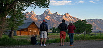 Photographers at the T.A. (Thomas Alma) Moulton Barn at sunrise. On Mormon Row, Antelope Flats, Grand Teton National Park, near Jackson Hole, Wyoming. USA. June 2013.