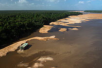 Gold dredger on Essequibo river, the longest river in Guyana, South America