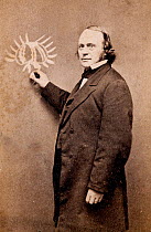 Photograph of Jean Louis Rodolphe Agassiz (1807-1873) shown teaching at a blackboard. Agassiz was a Swiss- American palaeontologist, geologist and glaciologist, and the main opponent to Darwin's Theor...