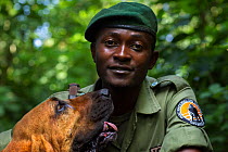 Congohound and handler used in anti-poaching activities. Virunga National Park, Democratic Republic of Congo, March.