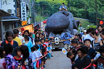 Japanese giant salamander (Andrias japonicus) festival in Yubara, with procession of male and female salamander shaped floats, Honshu, Japan, August.