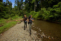 Eric Liner and Ian Fein, filming along a river in the Oransbari area, Irian Jaya, West Papua. August 2009.