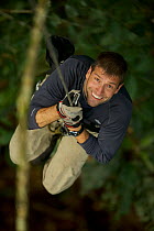 Eric Liner  climbing a tree, West Papua, Indonesia.