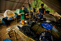 Expedition team packing up the lowland forest base camp near Oransbari, West Papua, Indonesia.