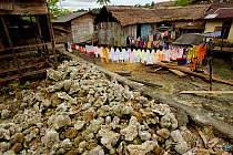 Laundry on lines and dead corals in Wakua Village, Aru Islands, Indonesia, September 2010.
