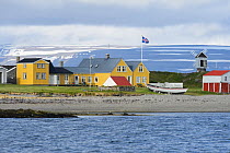 View of coastal buildings on Vigur Island, Westfjords, Iceland. July 2015.