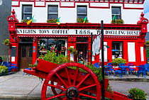 Painted hotel facade and cart in Knightstown, Valentia Island, Iveragh Peninsula, County Kerry, Republic of Ireland. September 2015.
