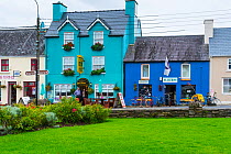 Colourful painted house facades in Sneem Village, Iveragh Peninsula, County Kerry, Republic of Ireland. September 2015.