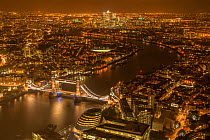 Aerial view of River Thames and Tower Bridge in London at night. October 2014.
