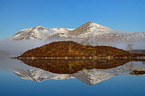 Black Mount and mist reflected in Loch nah Achlaise, Rannoch Moor, Argyll and Bute, Scotland, UK. March 2016.